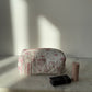 Trousse upcyclée matelassée blanche à motifs roses