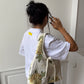 Sac upcyclé matelassé blanc à fleurs jaunes
