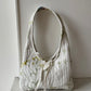 Sac upcyclé matelassé blanc à motifs