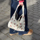 Sac upcyclé matelassé blanc/écru à fleurs