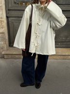 Veste écrue à fines rayures bleues