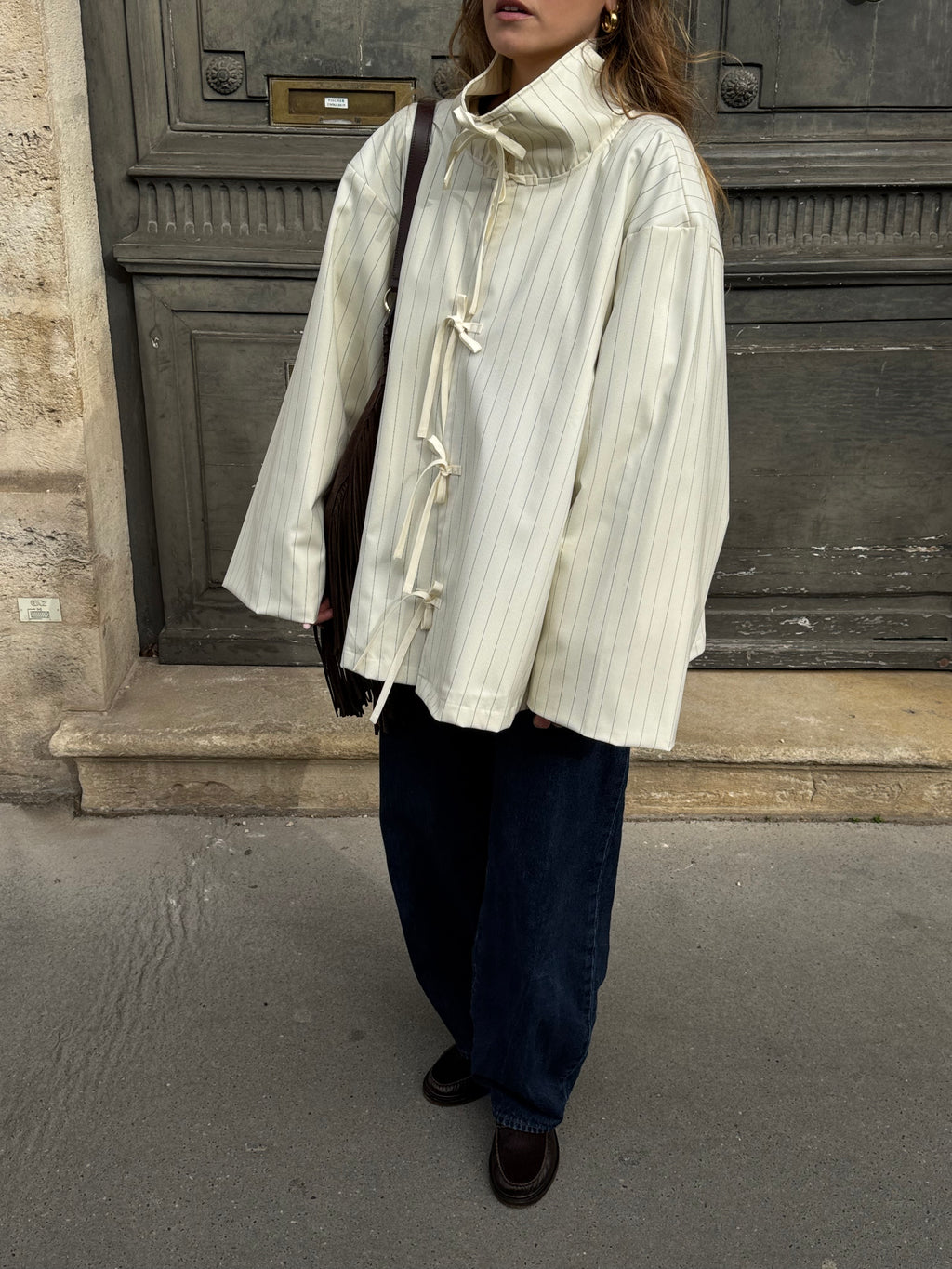 Veste écrue à fines rayures bleues