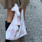Sac upcyclé matelassé nœud blanc à motifs