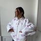 Veste upcyclée matelassée blanche à fleurs violettes