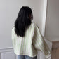 Veste upcyclée matelassée vert clair et motifs