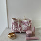 Trousse upcyclée matelassée blanche à motifs