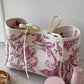 Trousse upcyclée matelassée blanche à motifs