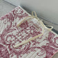 Pochette upcyclée matelassée blanche à motifs